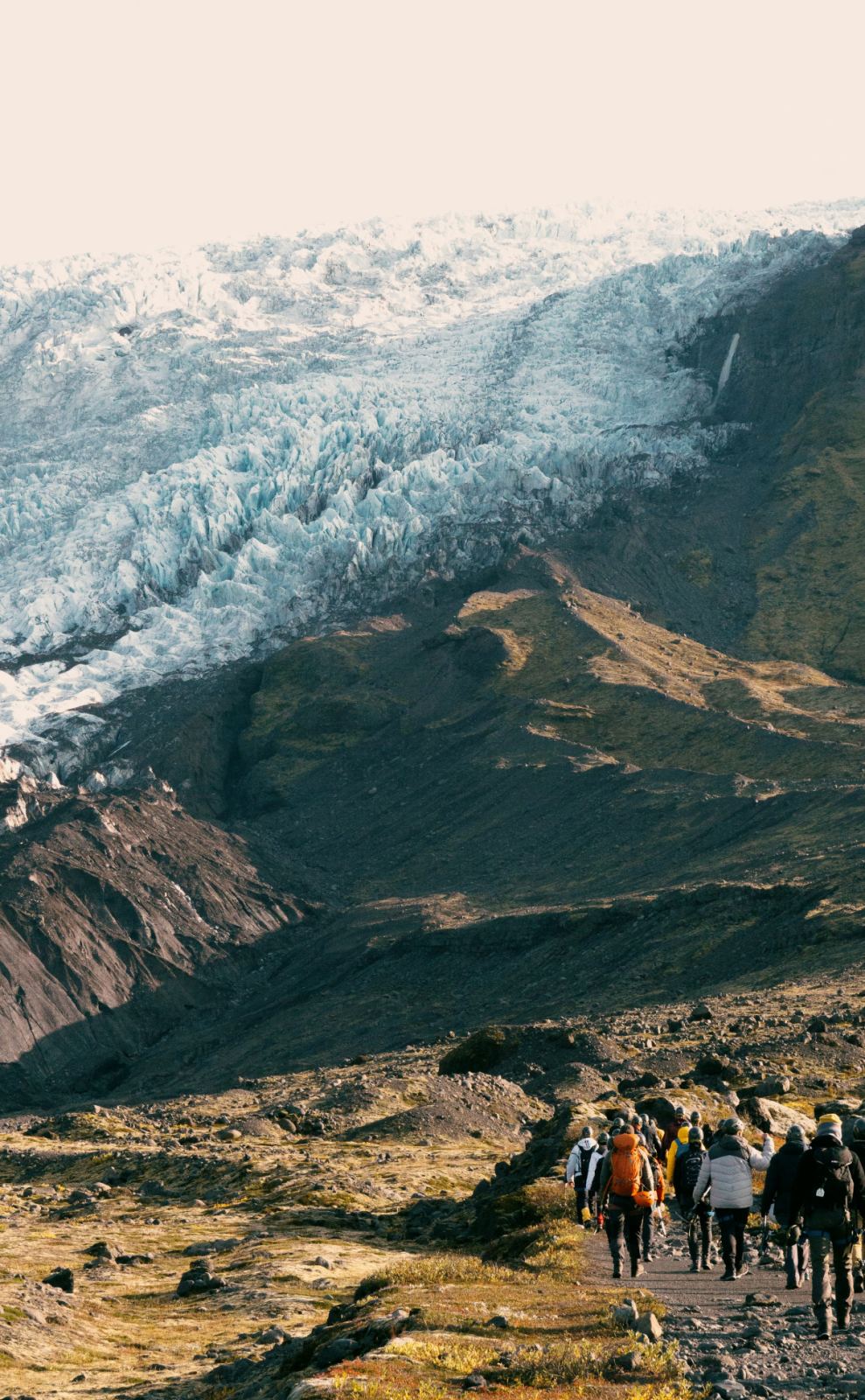 Hikers approaching a glacier, Skaftafell · Samuel Quek