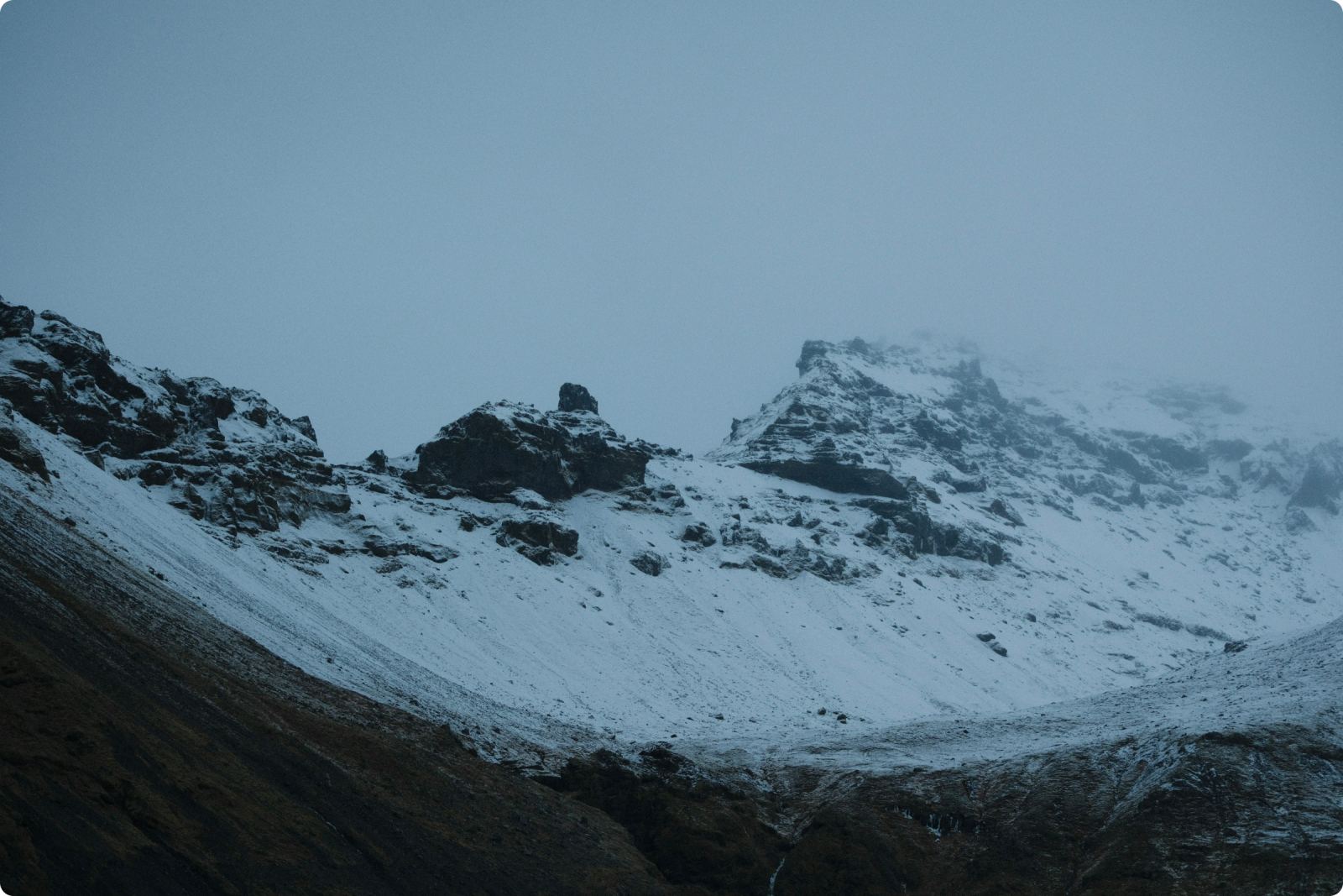 Snowy mountains seen from the glacier at Skaftafell.
